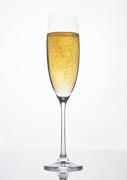 istock Glass of sparkling champagne with bubbles on white 614703020