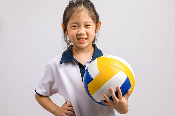 istock Kid Holding Ball, Isolated on White 614707848
