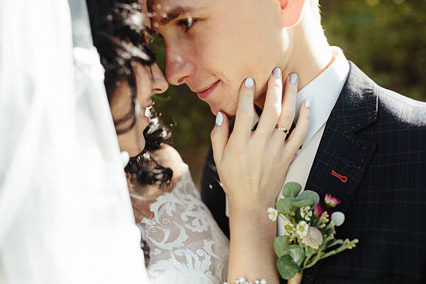 istock Bridal couple close to each other 614707878
