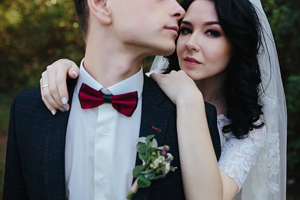 istock Bridal couple close to each other 614708484