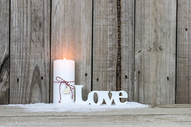 istock Christmas candle and the word Love 614708808