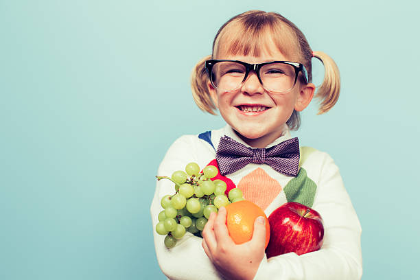 istock Young Nerd Girl Loves Eating Fruit 614711138