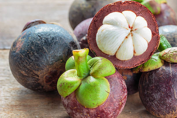 istock Mangosteen fruit on the ground. 614712298