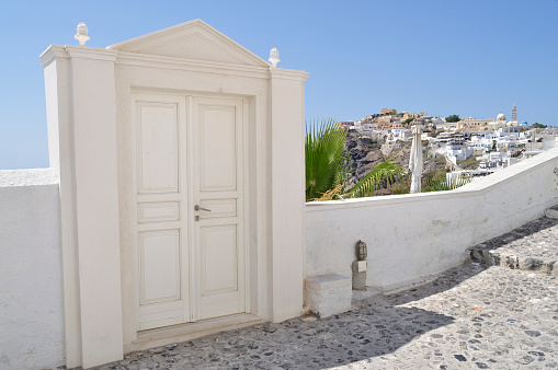 Door to nowhere - overlooking the sea - Santorini, Greece