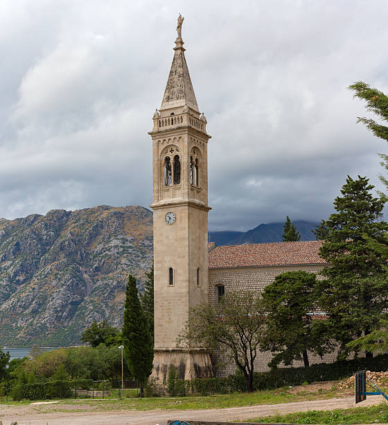 istock The bell tower on a background of mountains 614714220
