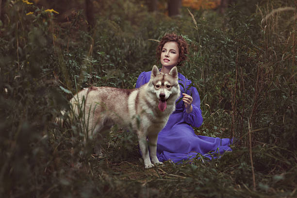 istock Girl with Husky dog. 614714672