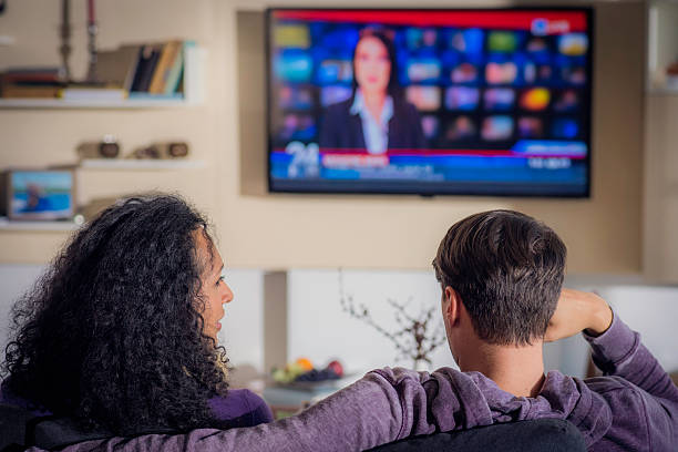 istock Young couple watching the news 614714988