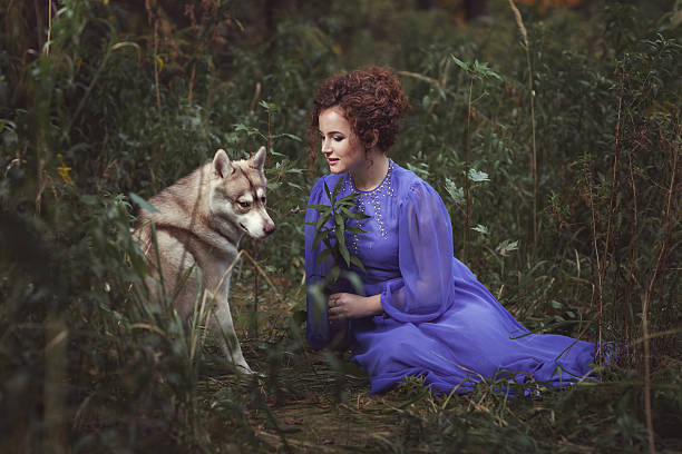 istock Girl says the dog tale. 614715074