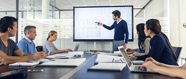 istock Architect presenting project to a group of managers 614715418