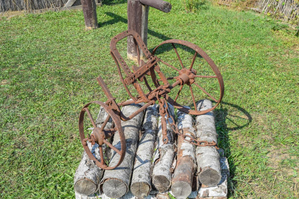 The old iron plow for digging the garden. Retro appliances, an open-air exhibit.