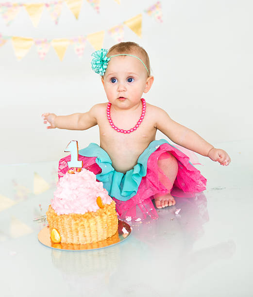 istock first birthday Portraits with smash cake 614716778