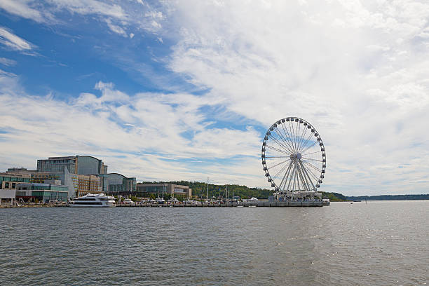istock National Harbor waterfront under blue skies with scenic clouds. 614717036