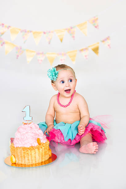 istock first birthday girl 614717192