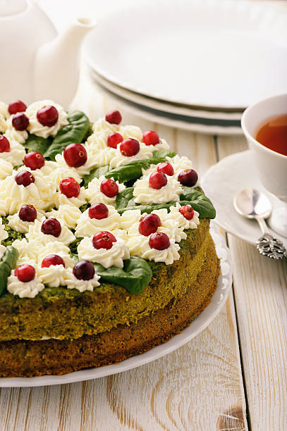 istock Spinach cake with cream and cranberries. 614720312