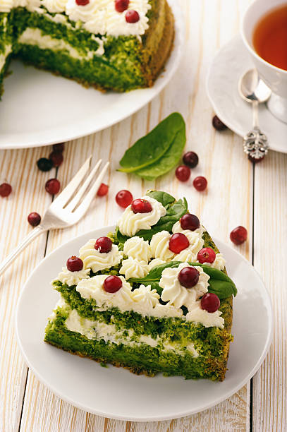 istock Spinach cake with cream and cranberries. 614720378
