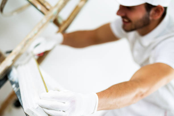 istock Young man repairing windows. 614720458