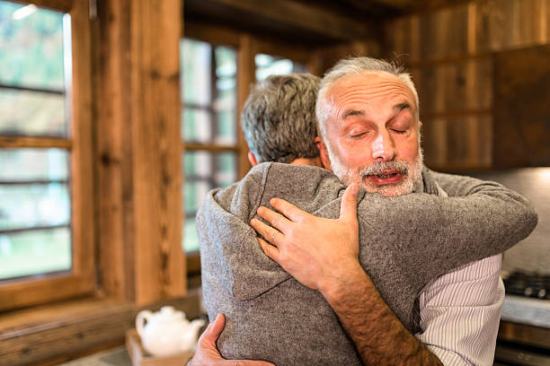 istock senior couple embracing passionate in the house 614720672