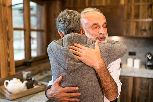 istock senior couple embracing passionate in the house 614720764
