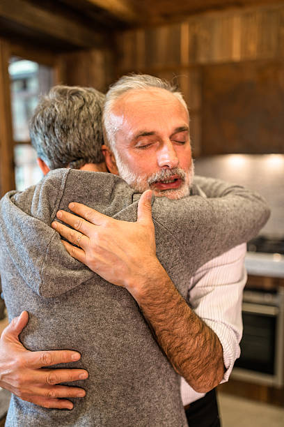 istock senior couple embracing passionate in the house 614720862