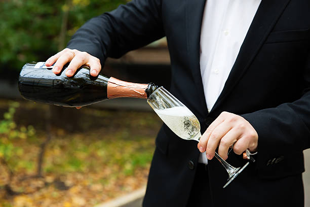 istock Pouring champagne into a glass 614721418