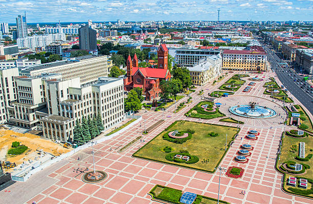 istock White Government Parliament Building And Lenin Statue on Independence Square 614721526
