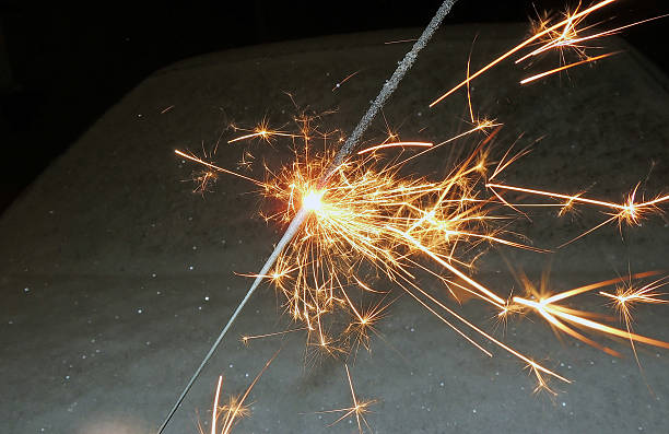 istock bright festive Christmas sparkler in hand toning 614723338