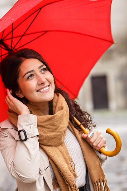 istock Woman with red umbrella 614724724