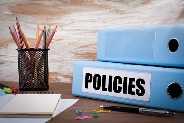 istock Policies, Office Binder on Wooden Desk 614724748