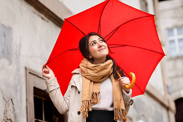istock Woman with red umbrella 614724984