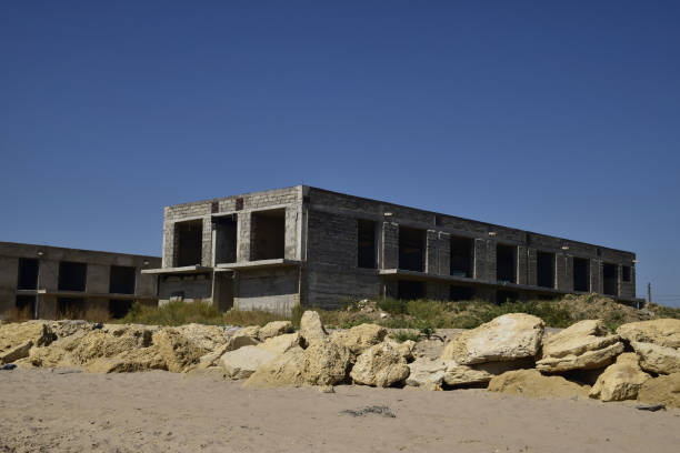 istock Unfinished building of gray block 614725070