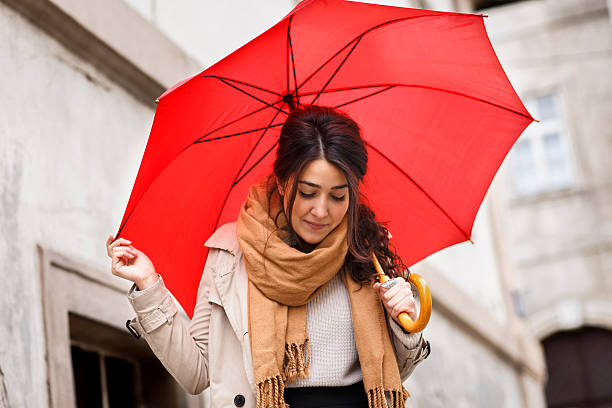 istock Woman with red umbrella 614725152