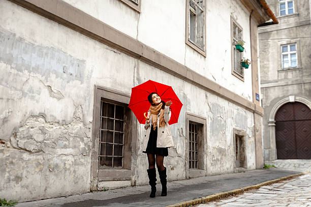 istock Woman with red umbrella 614725254