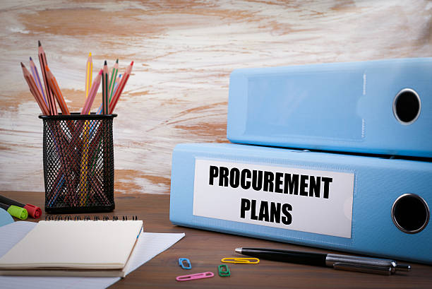 istock Procurement Plans, Office Binder on Wooden Desk 614725296