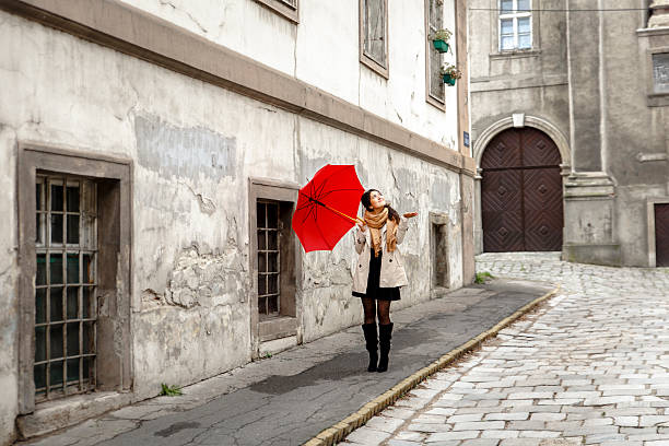istock Woman with red umbrella 614725342