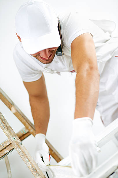 istock Young man repairing windows. 614725396