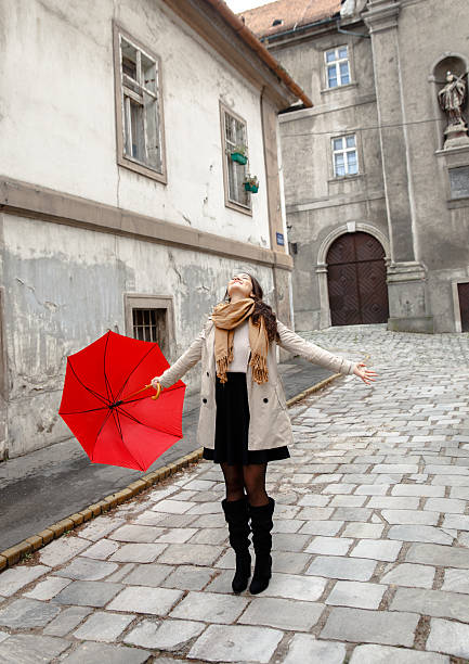 istock Woman with red umbrella 614725592
