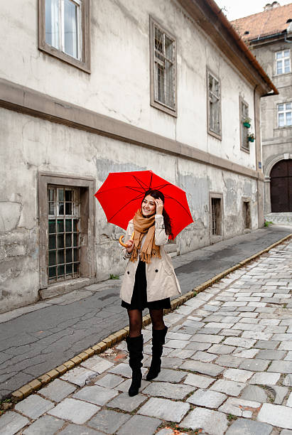 istock Woman with red umbrella 614725742
