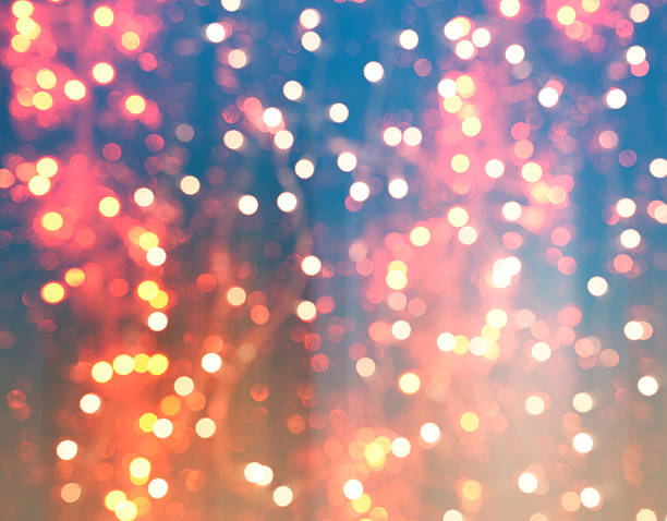 istock colorful abstract background blur motion with bokeh light 614728656