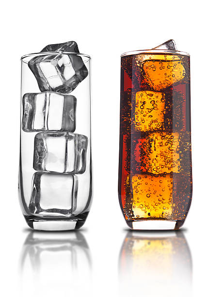 istock Glass of cola with ice cubes and empty glass 614729134