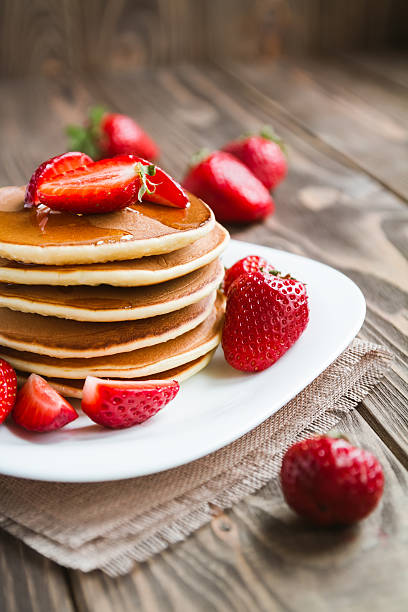 istock pancakes with fresh srtawberry on a table 614729762