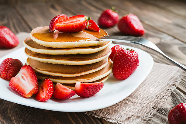 istock pancakes with fresh srtawberry on a table 614729830