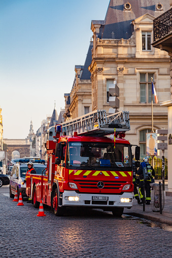 Paris, France - October 12, 2016: Fireman in his fire truck in the street of Paris, France.