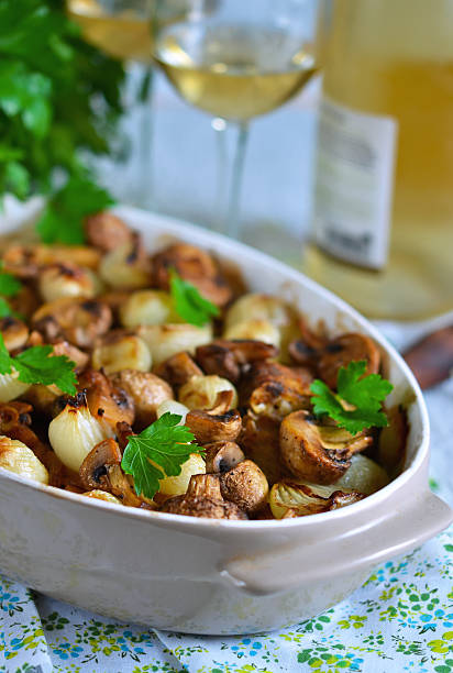 istock Baked fish with mushrooms, potatoes and onions 614731420
