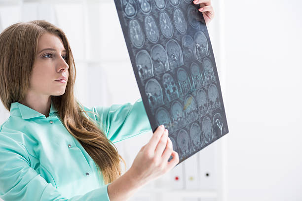 istock Brain surgeon in green gown 614734908