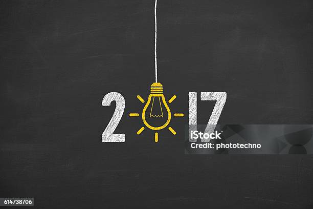 New Year 2017 Idea Concept On Chalkboard Background Stock Photo - Download Image Now