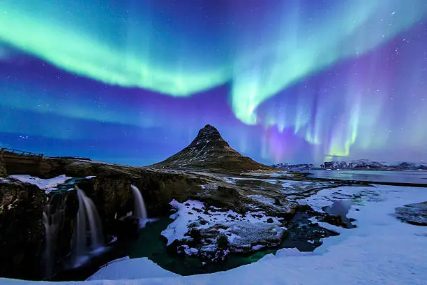 Mountain Kirkjufell and Aurora in Iceland.
