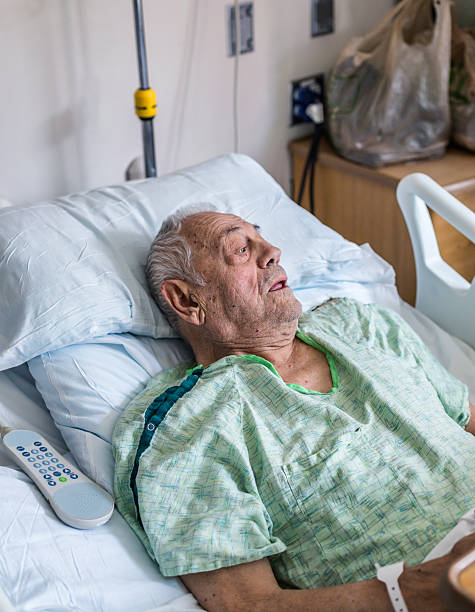 istock Worried Elderly Man Hospital Patient Asking Questions 614743792