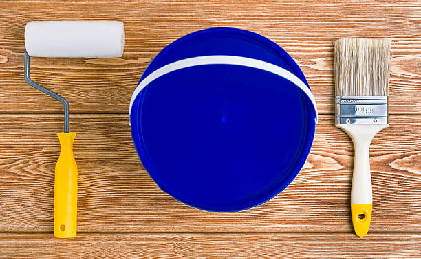 istock Bank of paint, paint brush and paint roller 614744174