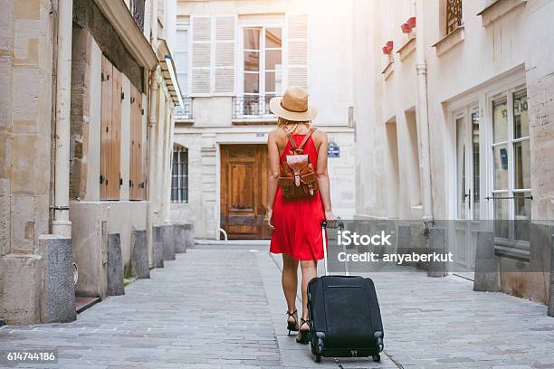 Hotel Tourist Walking With Suitcase On The Street Stock Photo - Download Image Now - Suitcase, Tourist, Hotel