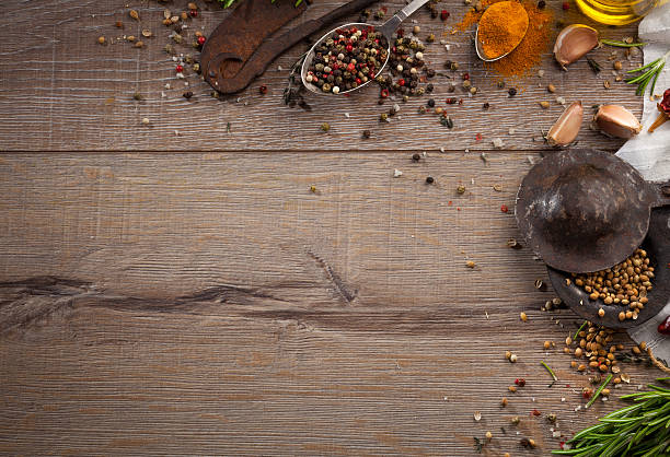 istock Various herbs and spices on dark wood table 614744510